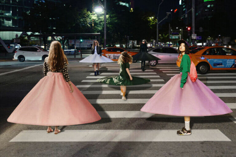 Toast fashion trend forecast with social distancing skirts worn by three girls on a street
