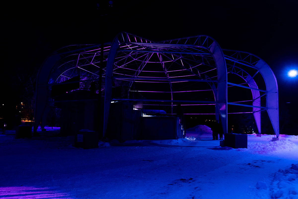 A night shot with blue and purple lights at Winter City Snow Glow, Shakespeare on the Saskatchewan in Saskatoon