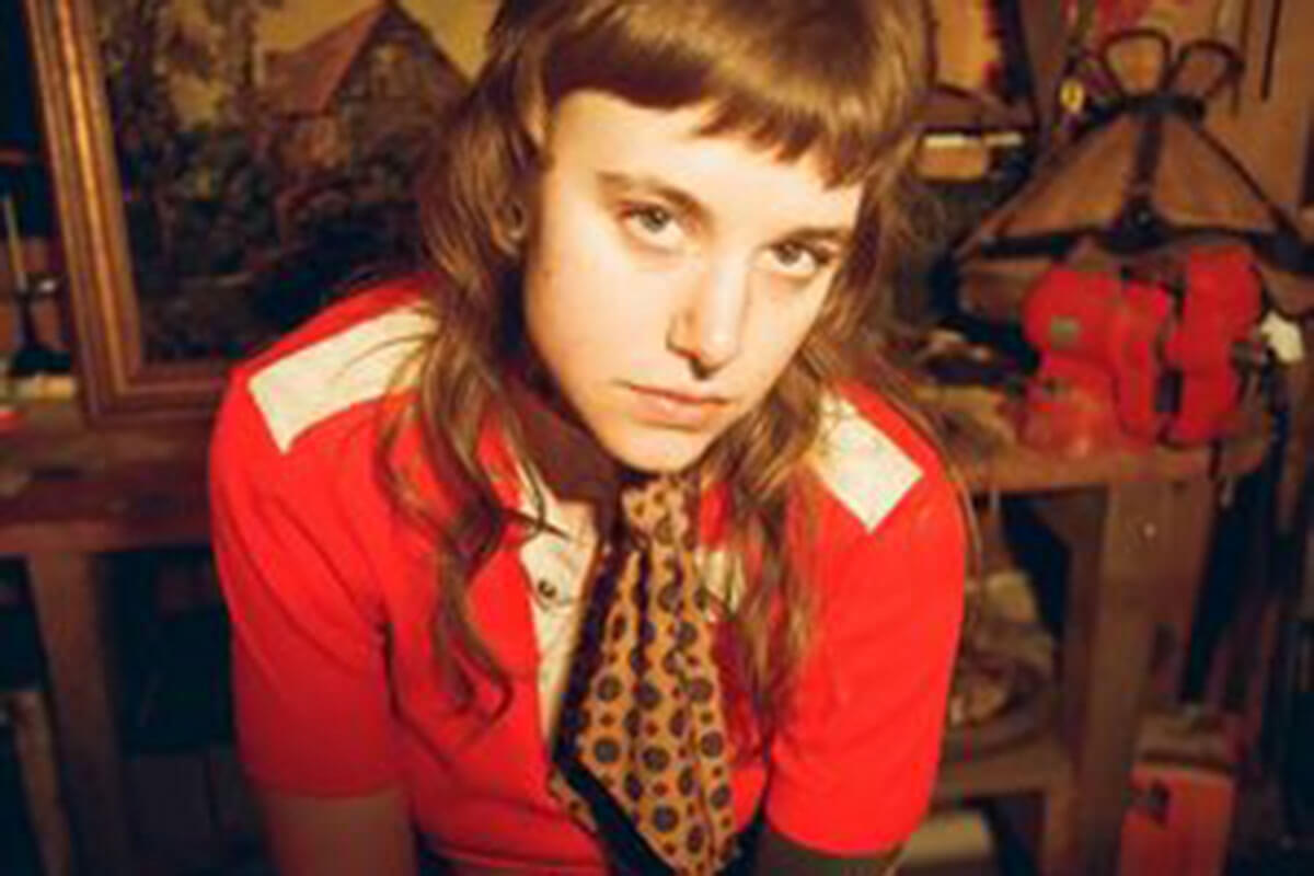 Wearing a red shirt, Cat Clyde is one of our 5 up-and-coming Canadian musicians