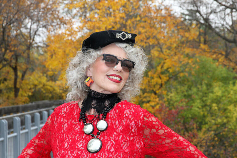 Woman modelling in red jacket and black beret, living out loud at any age