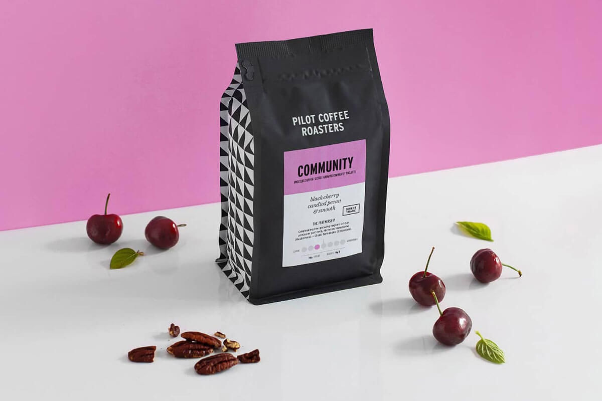 Black, white and pink package of Pilot coffee, in the top 5 of Toronto coffee roasters