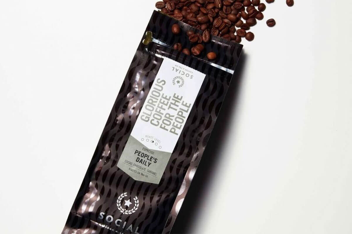 brown and white package of Social Coffee & Tea Co. coffee beans, among the top 5 Toronto coffee roasters