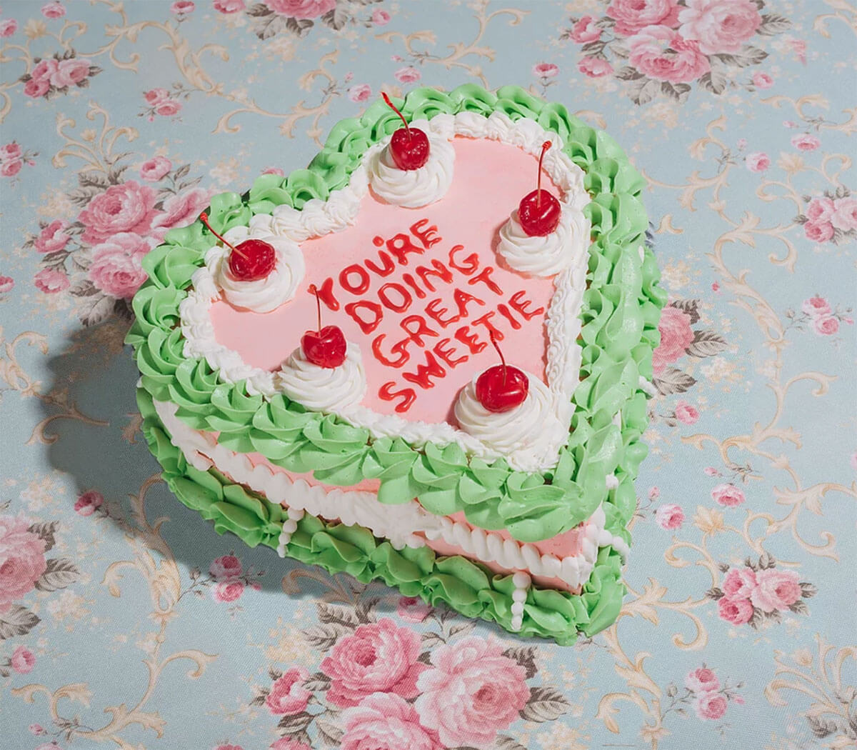 Green, pink and white heart-shaped cake by Briony Douglas, one of  many Canadian visual artists