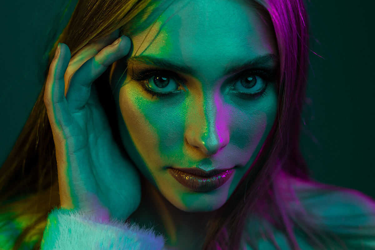 Coloured light mixing used in portraits of a model featured magenta, blue & cyan