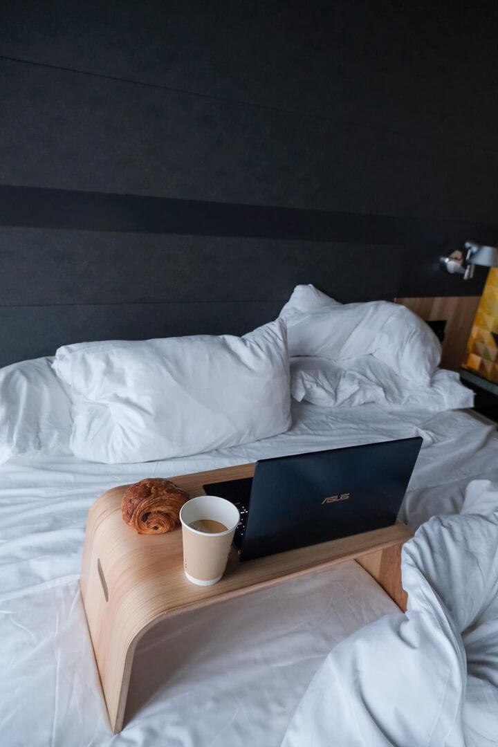 Working from bed with a coffee and bagel at the Alt Hotel, one of many March activities in Saskatoon