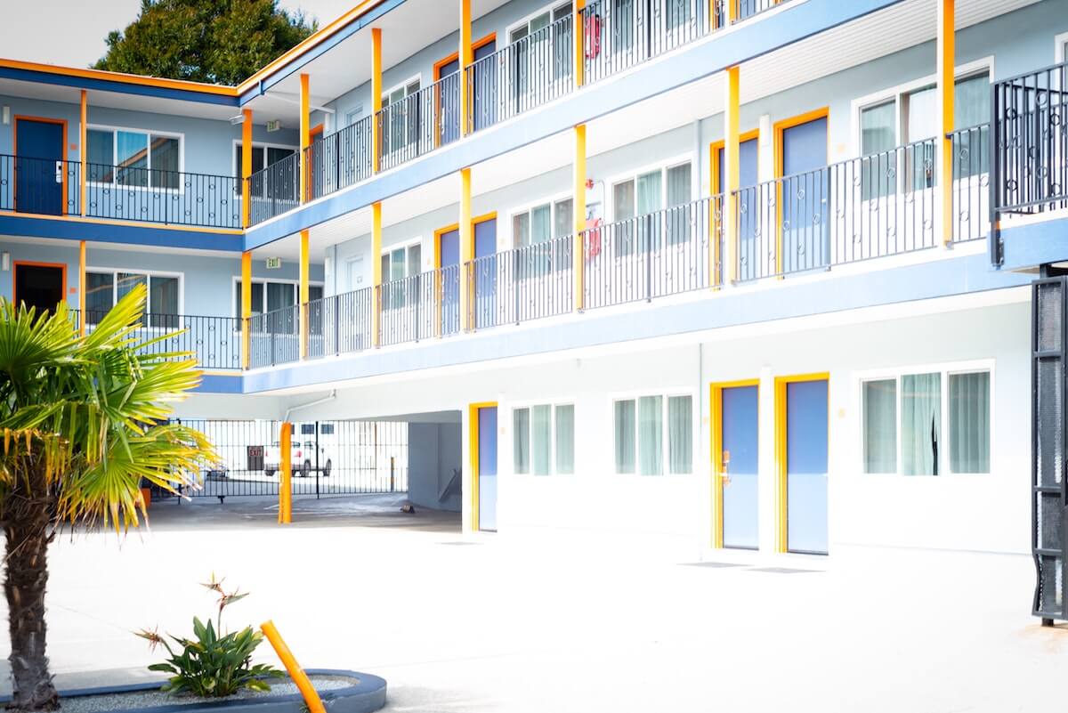 a tropical blue, white and yellow hotel