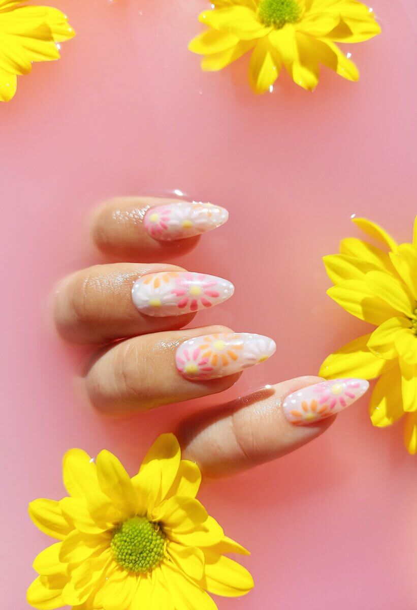 Long white press-on nails with orange and pink flowers