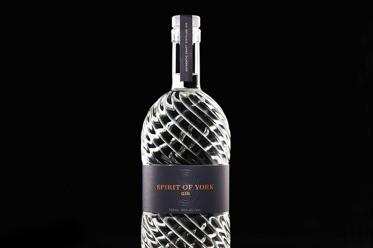 a bottle of Spirit of York on a black background, one of four Toronto craft gins