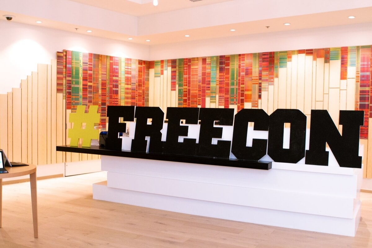 blak freecon sign with colourful background