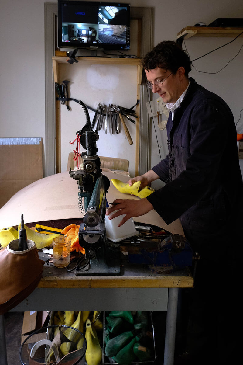 Adam Finn building custom made shoes in his Saskatoon workshop