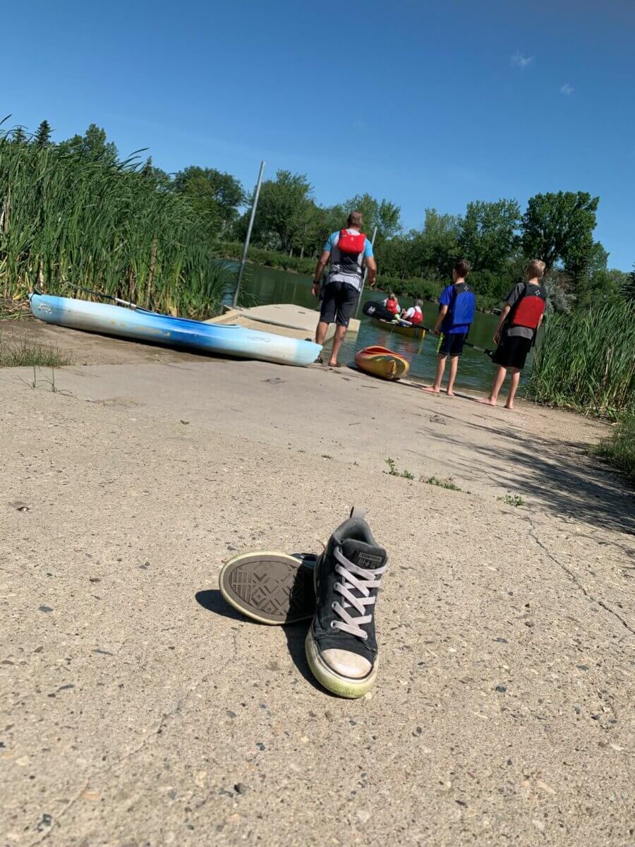 people boating on a small lake near Moose Jaw