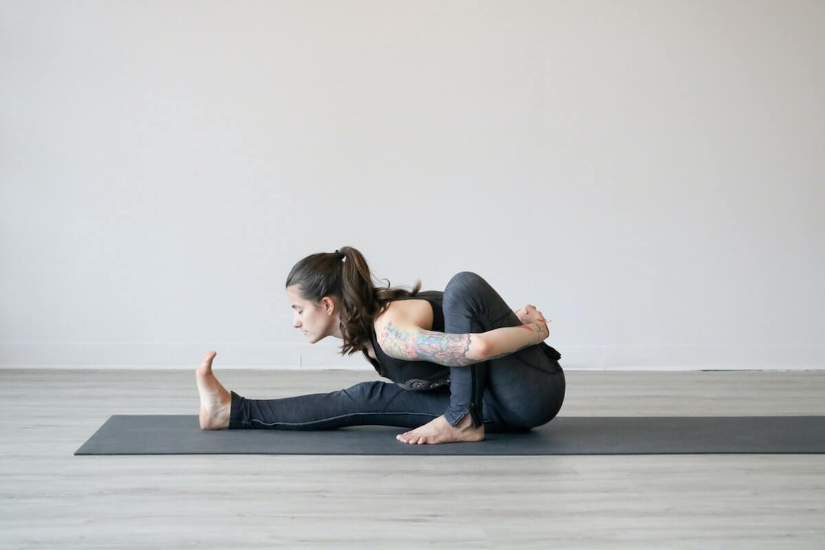 woman stretching, one of 4 ways to get a better sleep