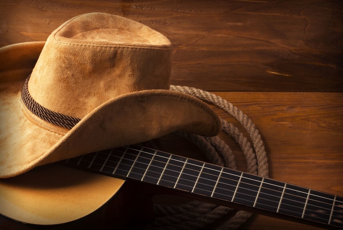 cowboy hat, guitar and rope, john michael montgomery in austin