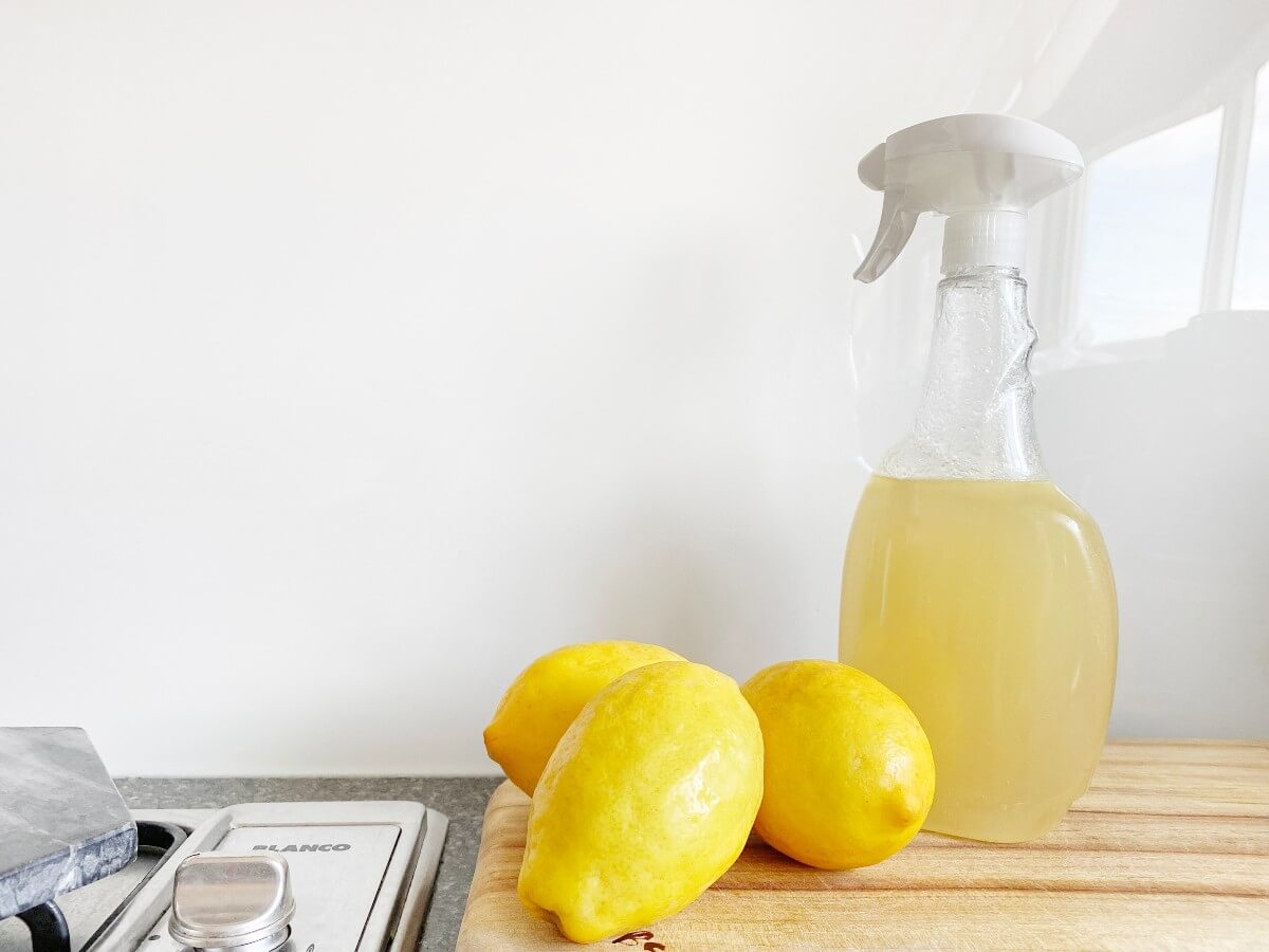 3 lemons and a sprayers on a countertop for spring cleaning, 1 of 5 natural mood boosters