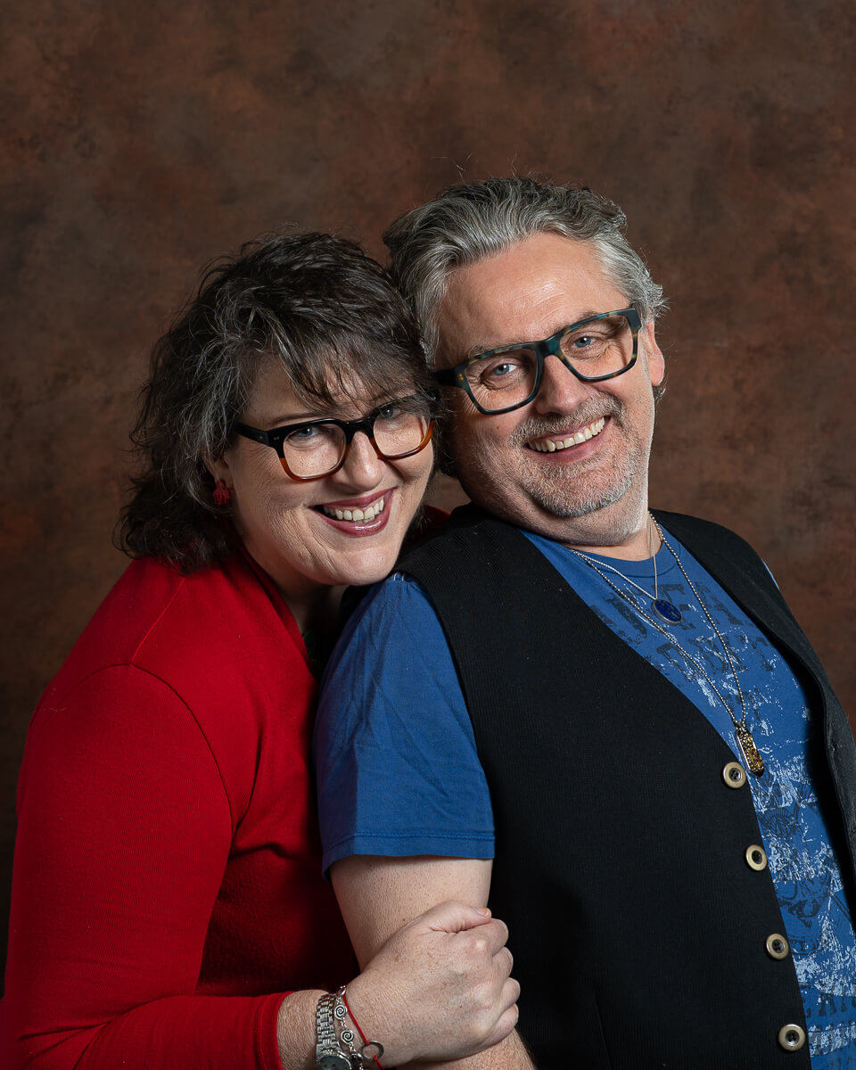 Claire Donnison in red and Andy Wright in blue and black, a head and shoulders shot