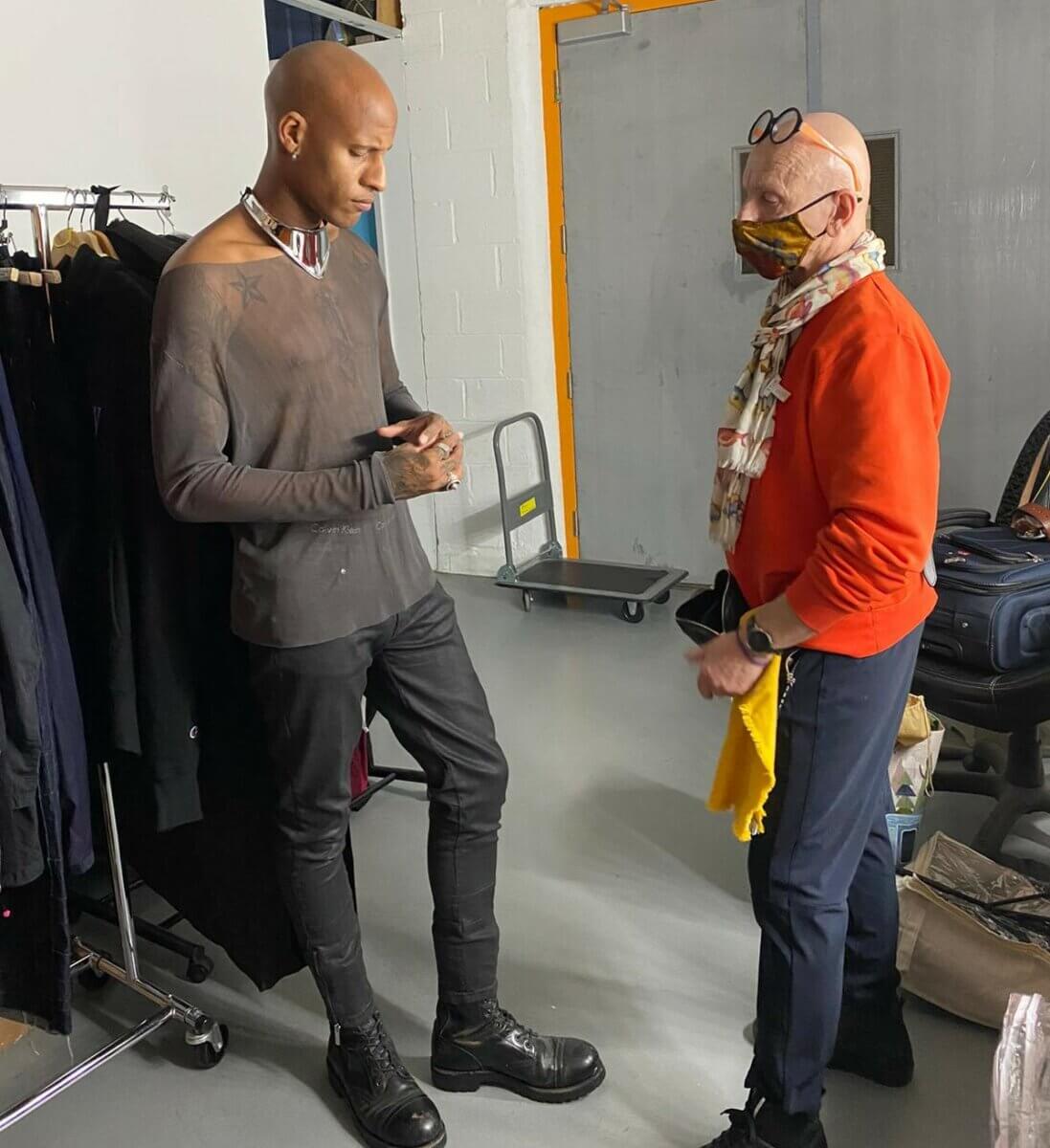 black man and a white man in a styling area behind the scenes, just john and jp michaels