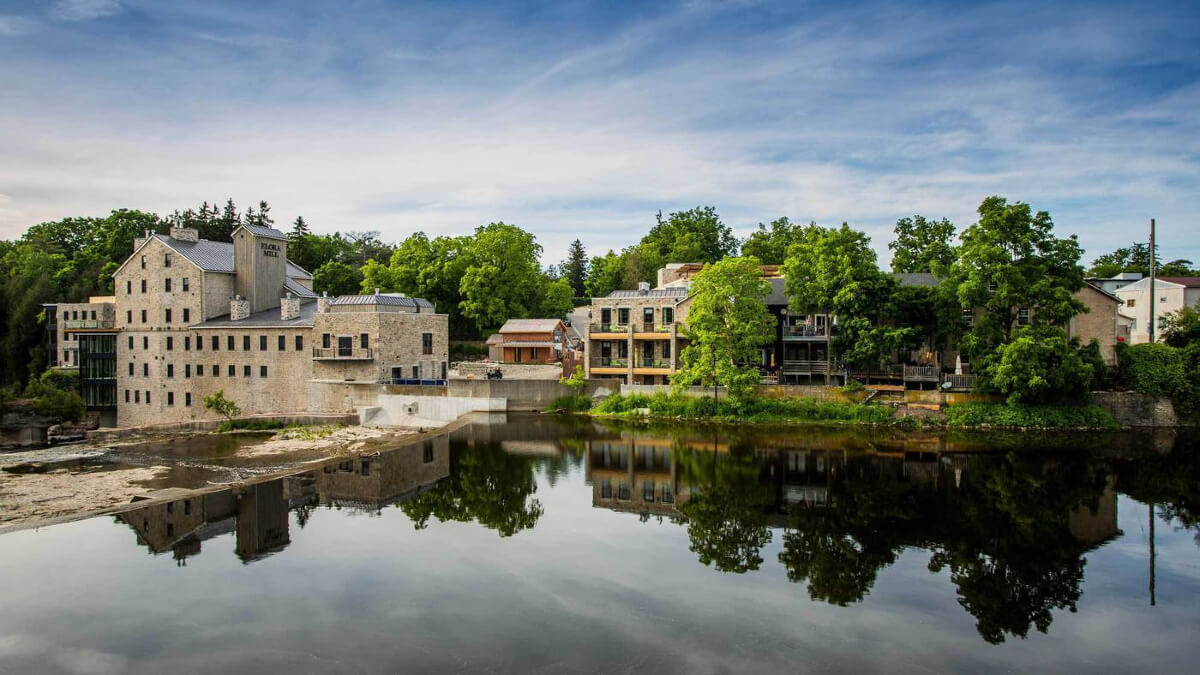 historic hotel and spa near a lake surrounded by trees