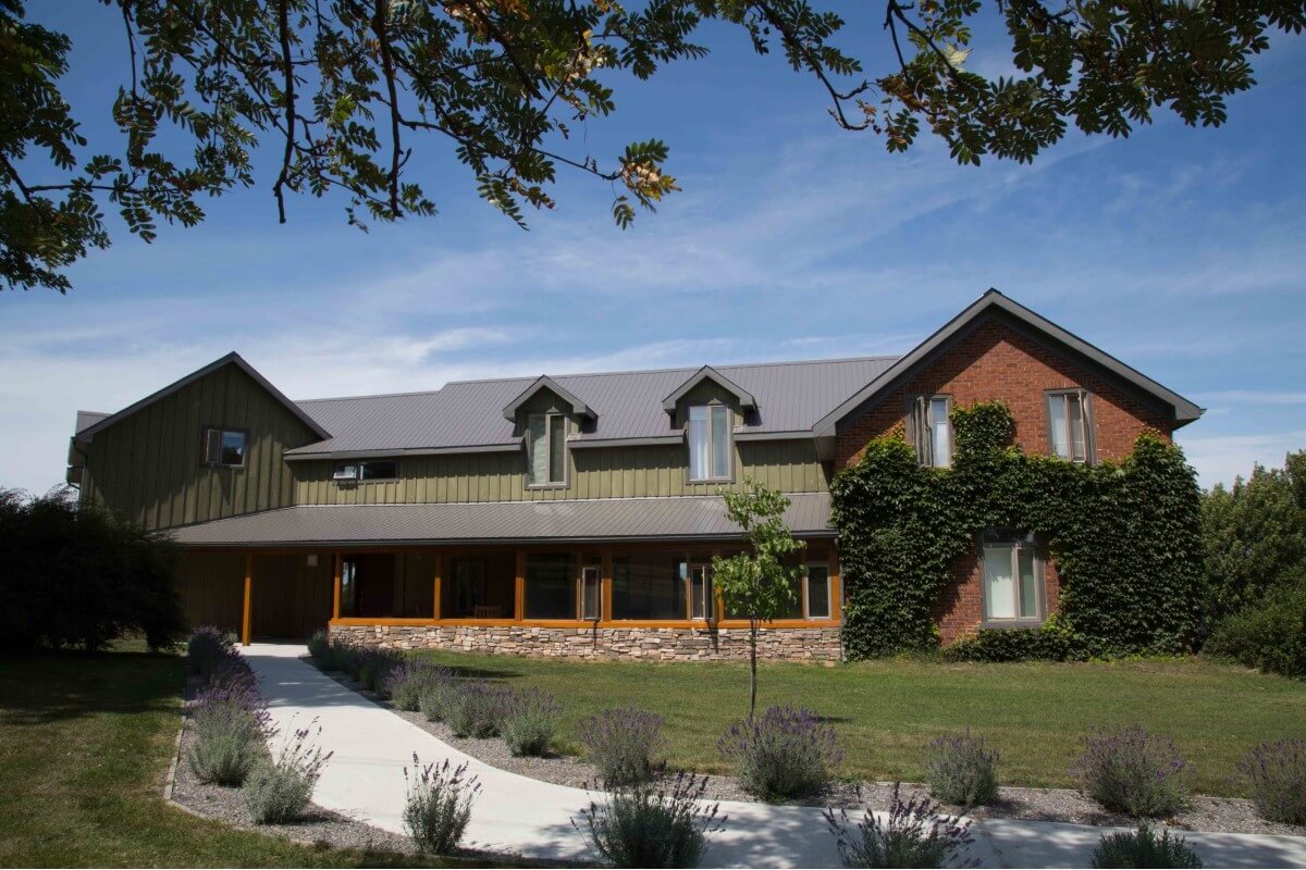 one of Ontario's best weekend getaways, a green, brown and brick building at Away in the County, 