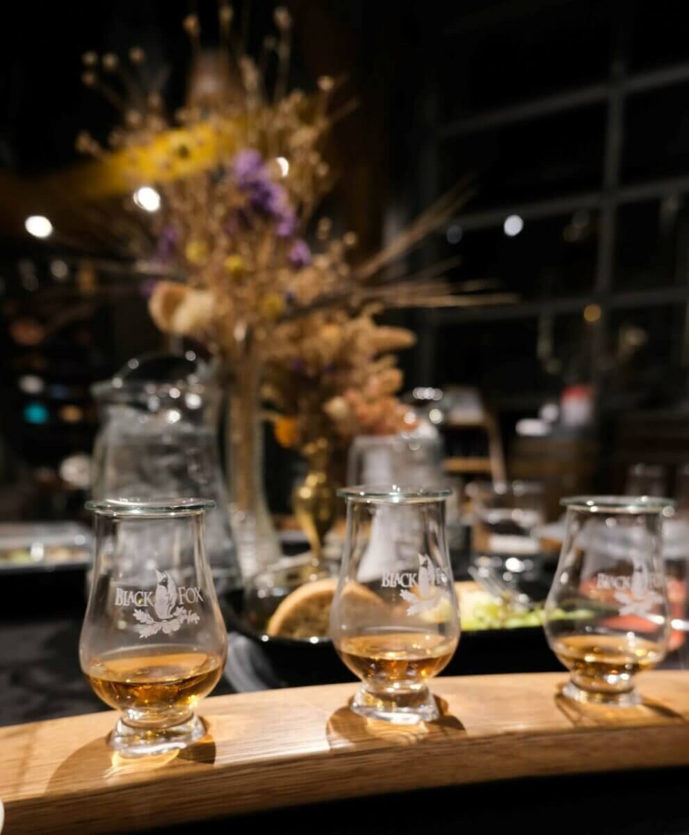 3 glasses in a whisky flight on a cocktail bar