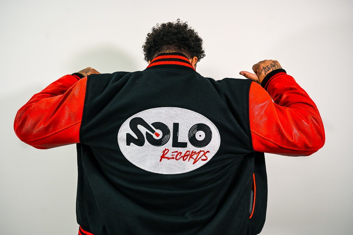 tony solo hearst showing back of his jacket with Solo Records logo