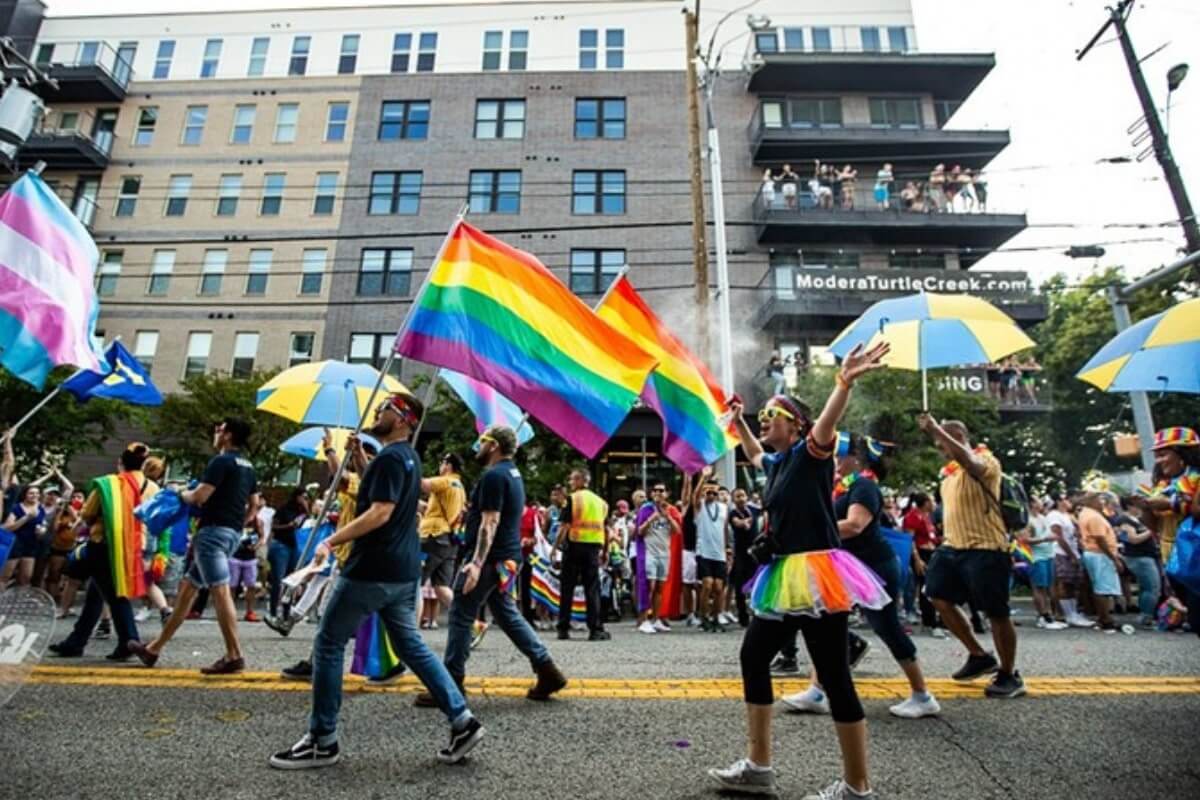 people marching in dallas pride parade