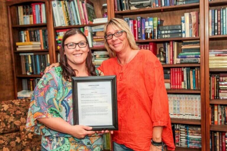 2 women with a certificate from truth be told programs
