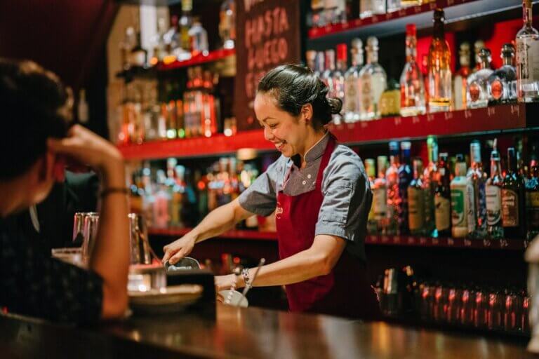 woman bartending for bartenders benevolent fund