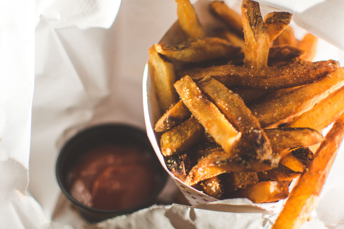 a basket of french fries cooked in an air fryer