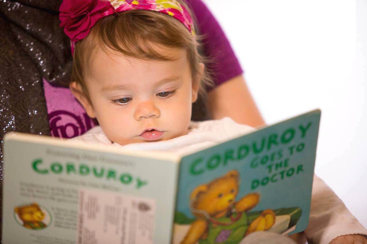 A young child reading a book