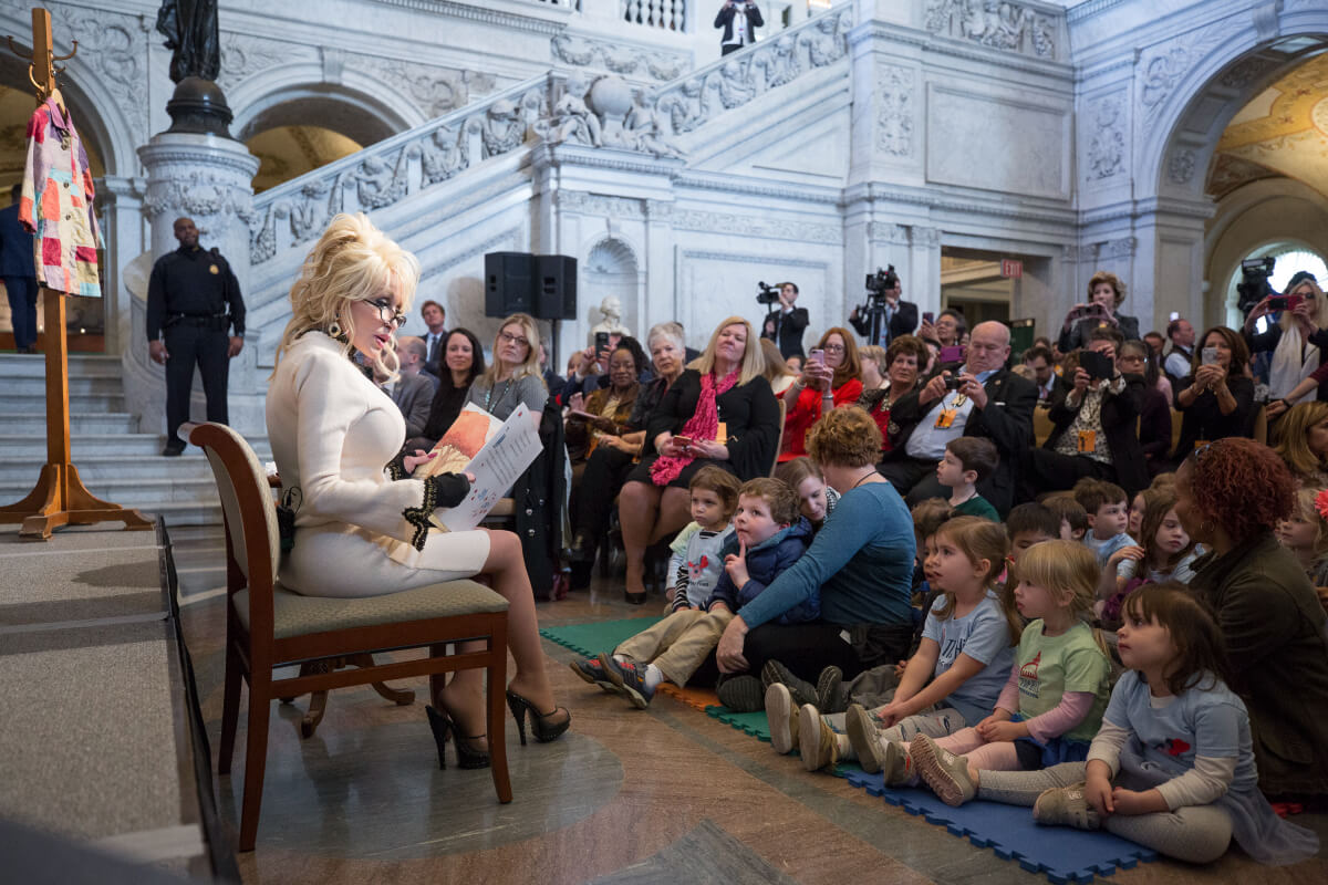 Dolly Parton reading to children and adults at the USA Library of Congress