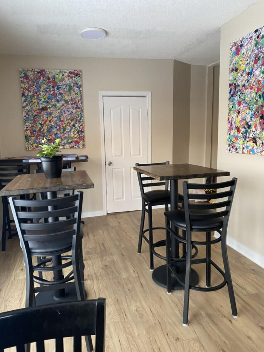 tables and chairs in elle's cafe in regina