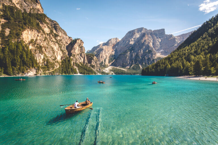 canoes on a mountain lake are green travel