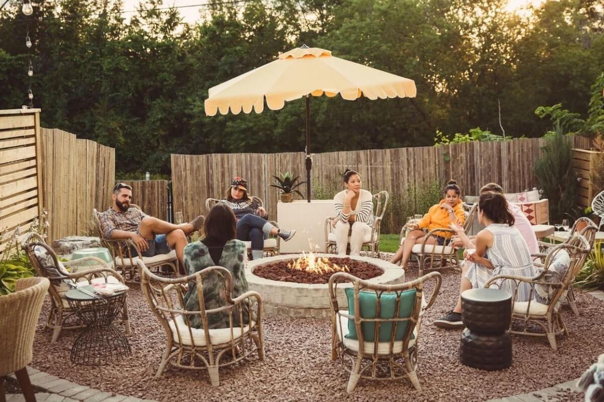 people sitting around a campfire at The June Hotel, one of the most popular Canada hotels