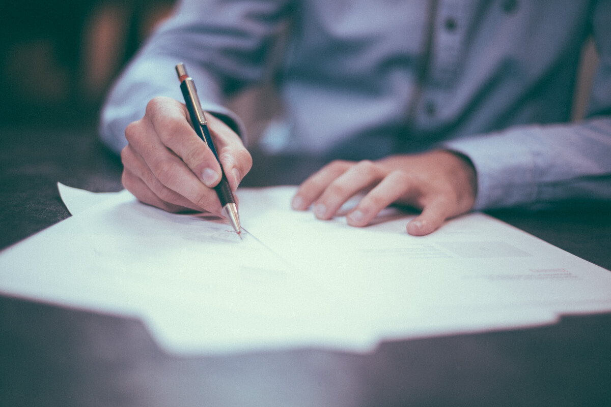 person writing a letter to fight climate change