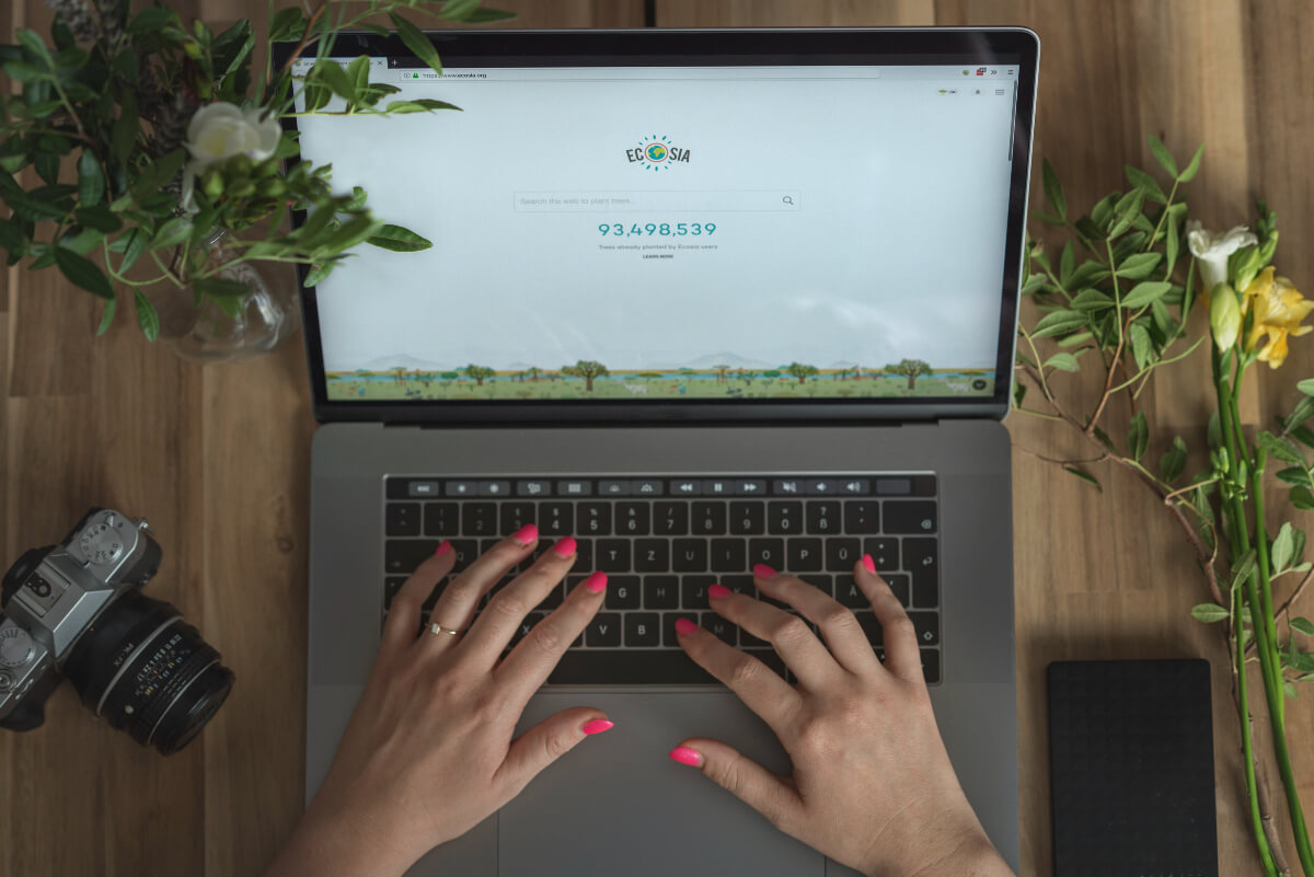 person searching with ecosia browser on a laptop