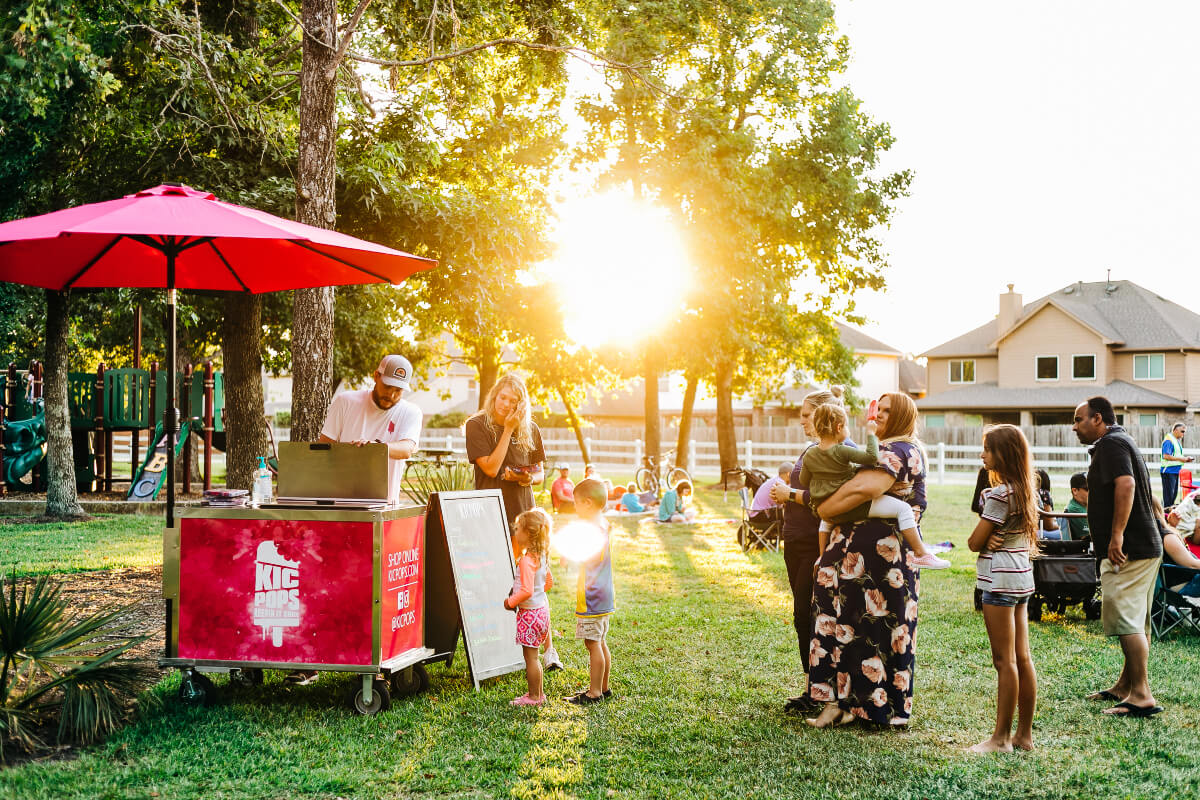 people lining up for ice pops at the KicPops stand