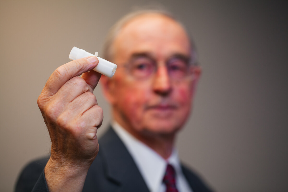 Man holds the pain-free micro-needle that will help those with a fear of needles.