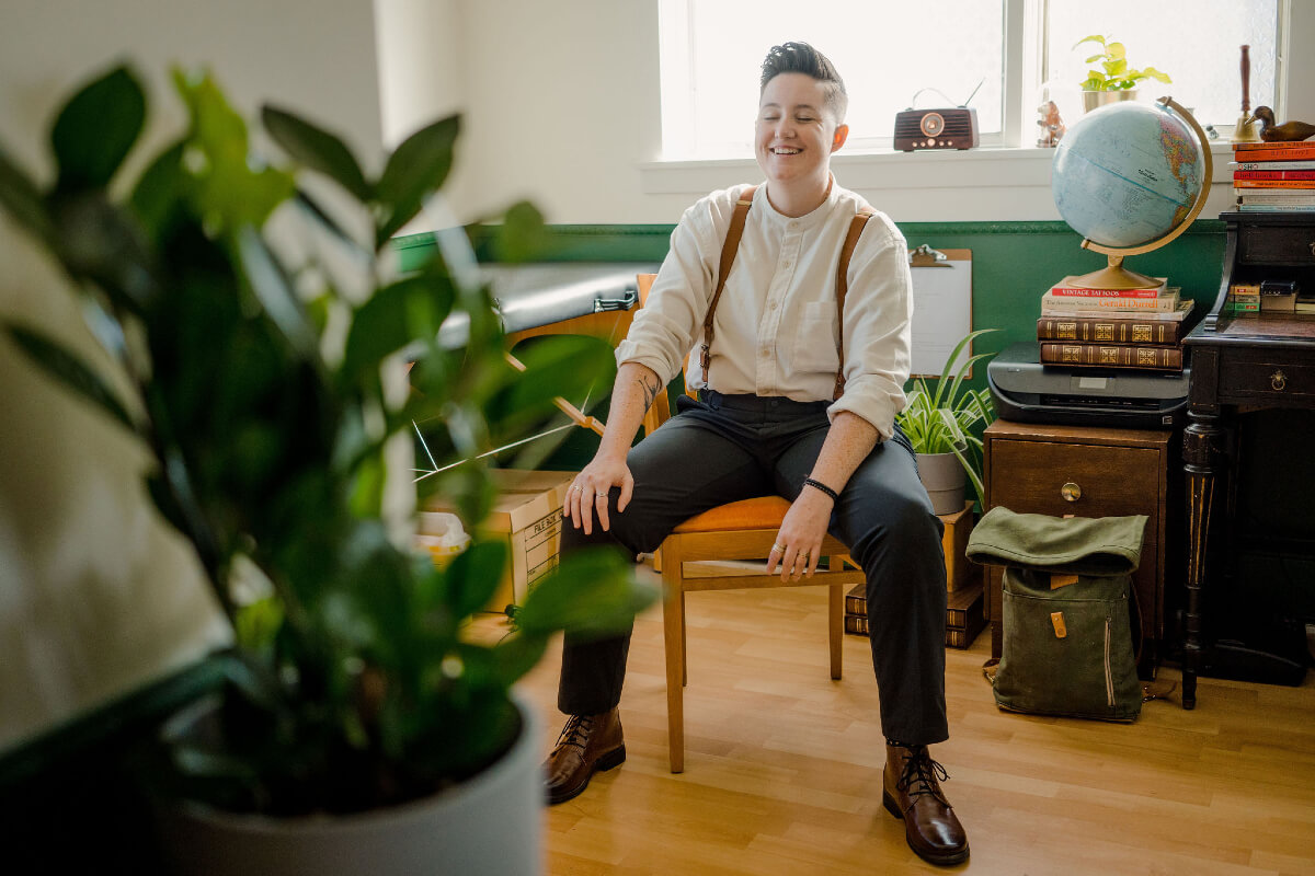 The Nightingale Academy is creating a safe, intimate space for the queer community. Logan Gray sits and smiles in a sunny office.