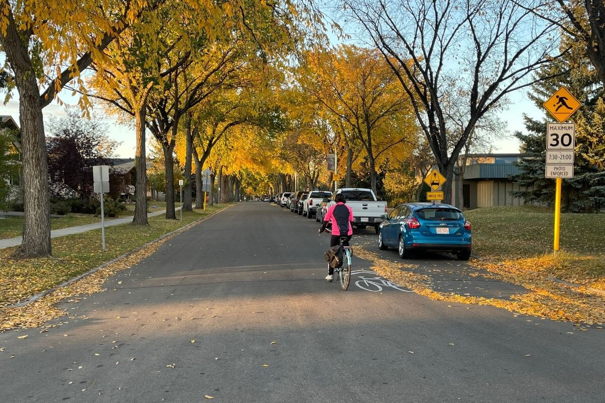 Azra Chatur on her active commute, riding her bike down the street 