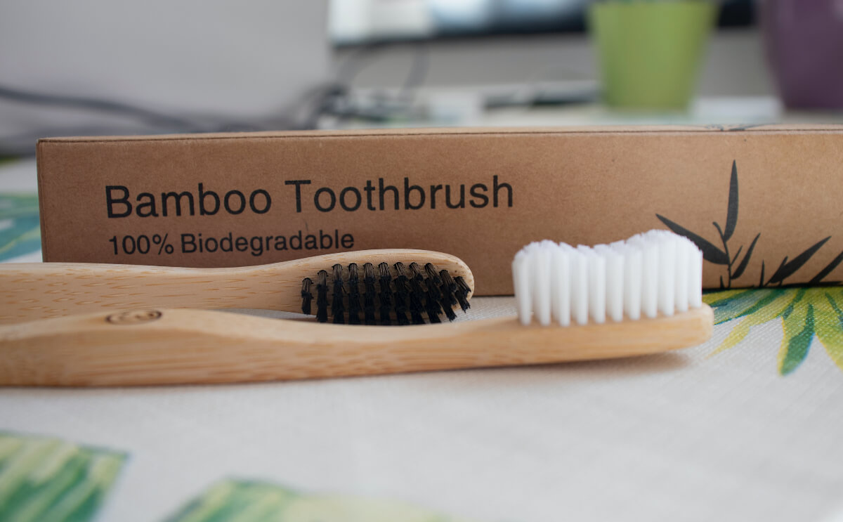 A bamboo toothbrush is an example of plastic-free beauty.