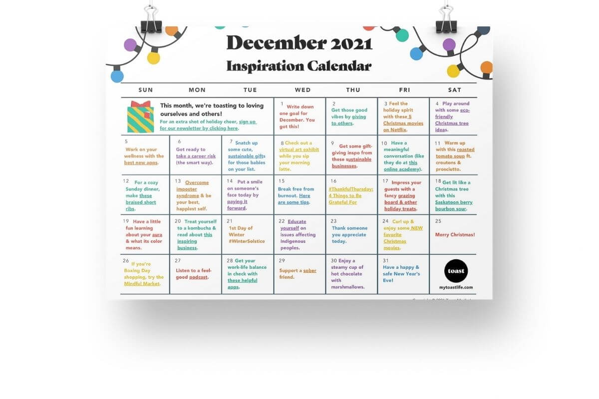 December Inspiration Calendar hanging from butterfly clips. 