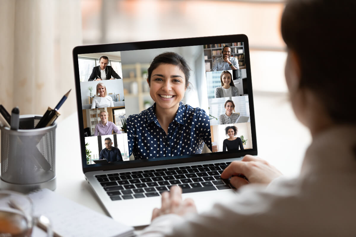 Person on a video conference call. It looks like a fun meeting because everyone is smiling. Their work apps must be doing them right. 