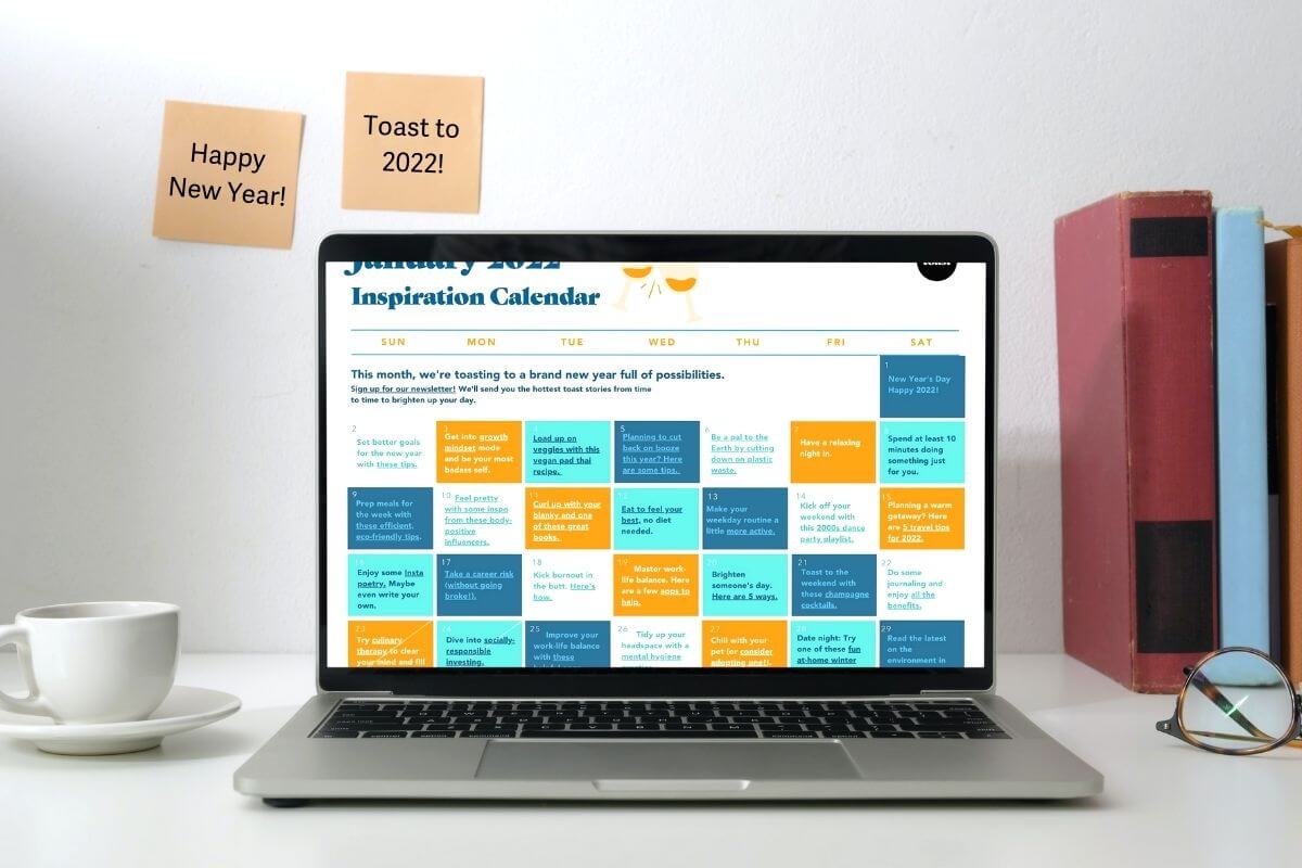 Laptop on a desk featuring the Toast Inspiration Calendar