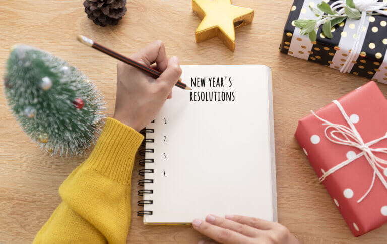 New Year's Resolutions written at the top of a new page in a notebook