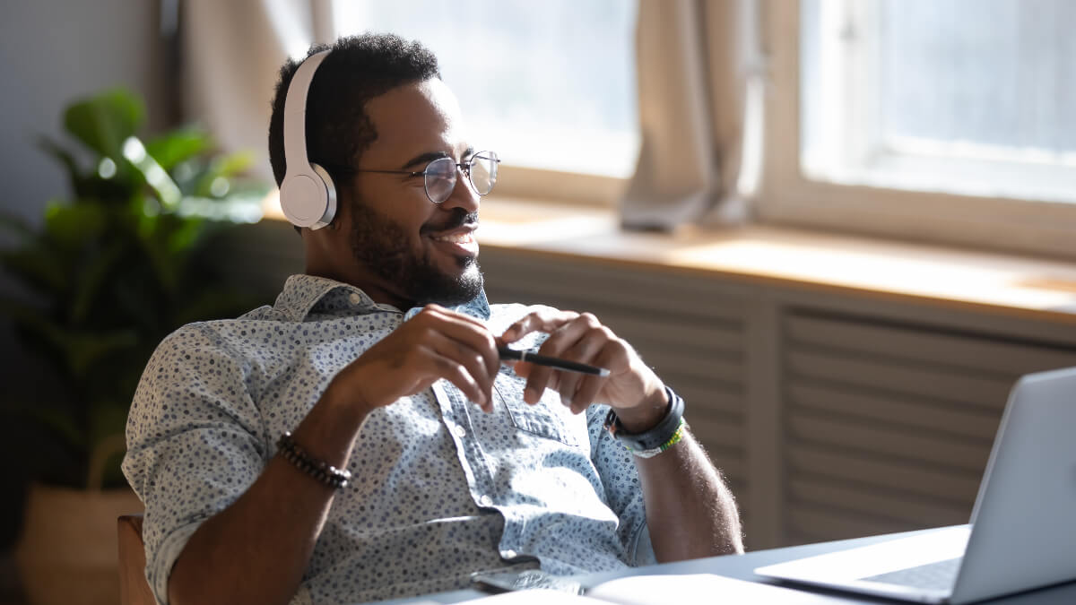 A person attending a webinar on the computer.