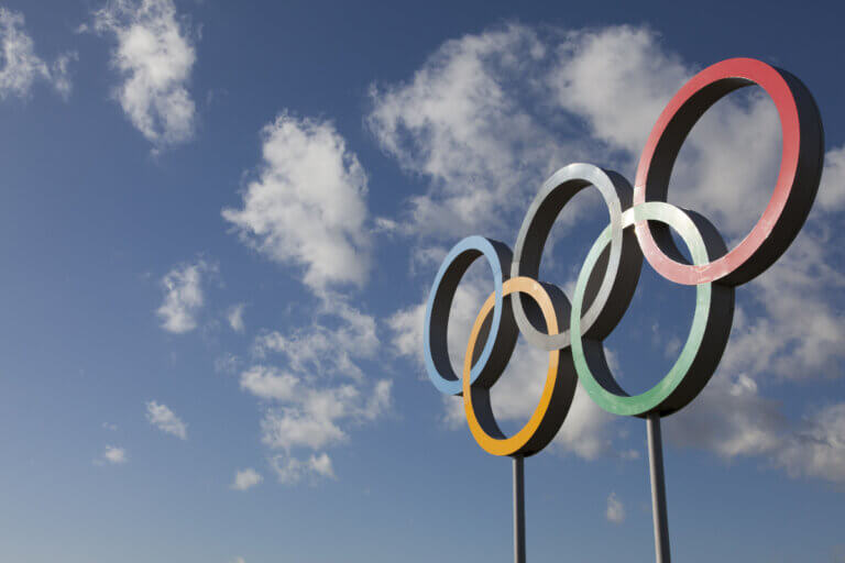 View of the Olympics 5 rings logo against a blue sky