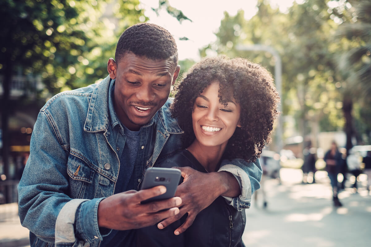 Young happy black couple in a park