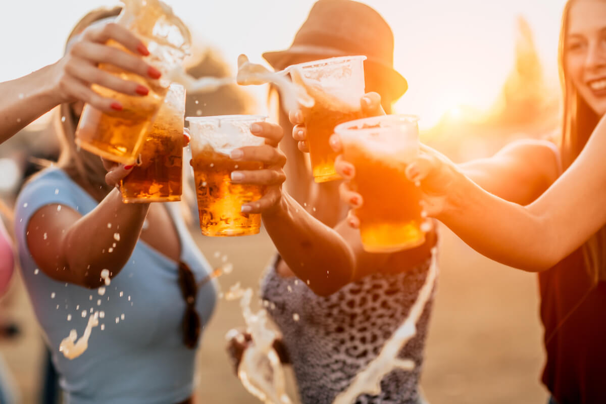 Group of friends making cheers with their drinks