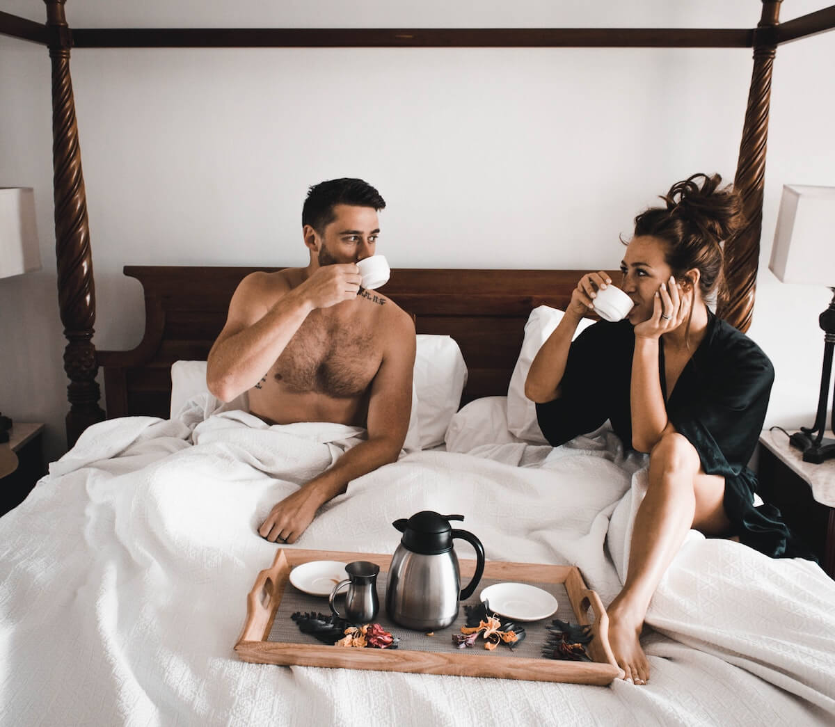 a couple having breakfast in bed