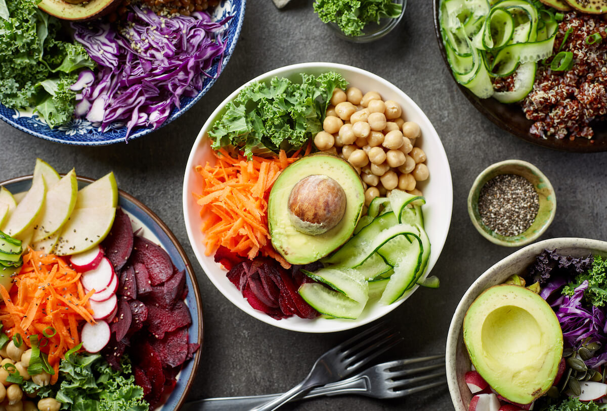 Breakfast vegan bowls for healthy eating on gray table, top view